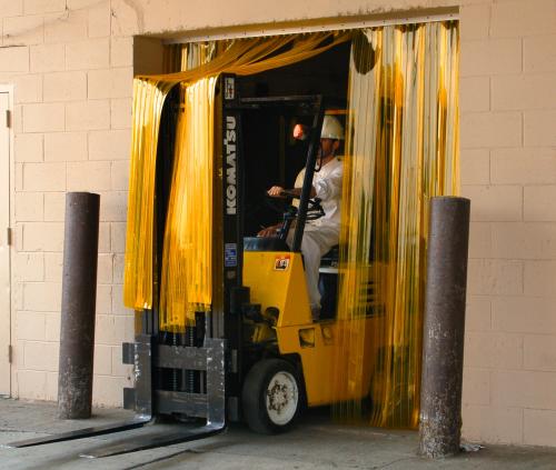 man in forklift passing through anti-insect yellow pvc