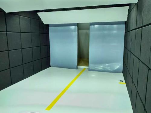 Shooting lane with grey acoustic panels and clear strip entry curtains.  File name: shooting lane clear strip curtains.jpg